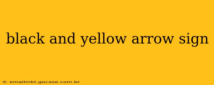 black and yellow arrow sign